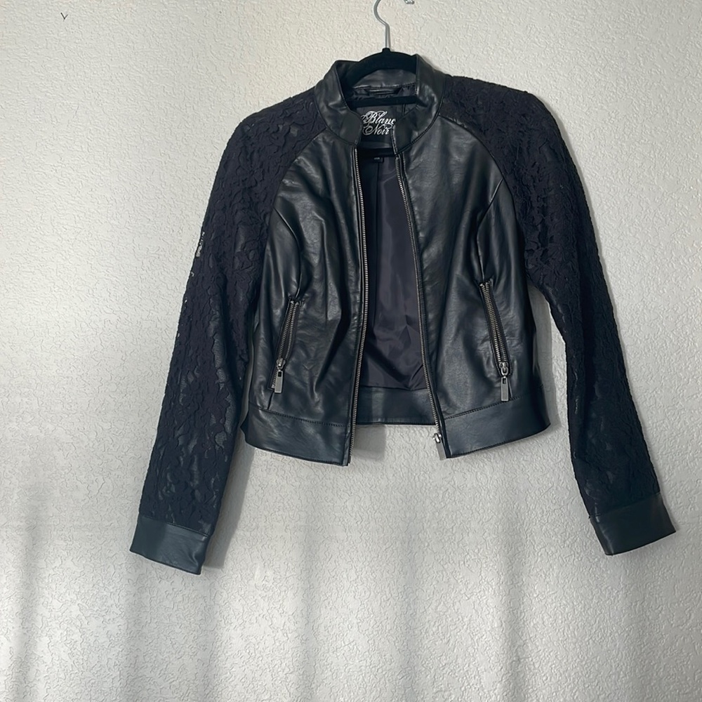 Women’s black leather jacket with lace.